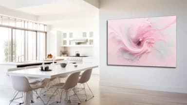 An airy, white-walled kitchen is livened up with a large, abstract wall art piece. The art features various tones of pink swirled with white and grey, providing an engaging focal point without overwhelming the space.