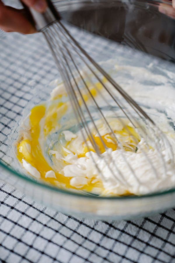 Whipping egg whites in a glass mixing bowl